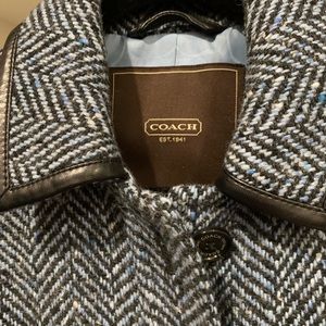 Like new, fashionable blue Coach coat.
